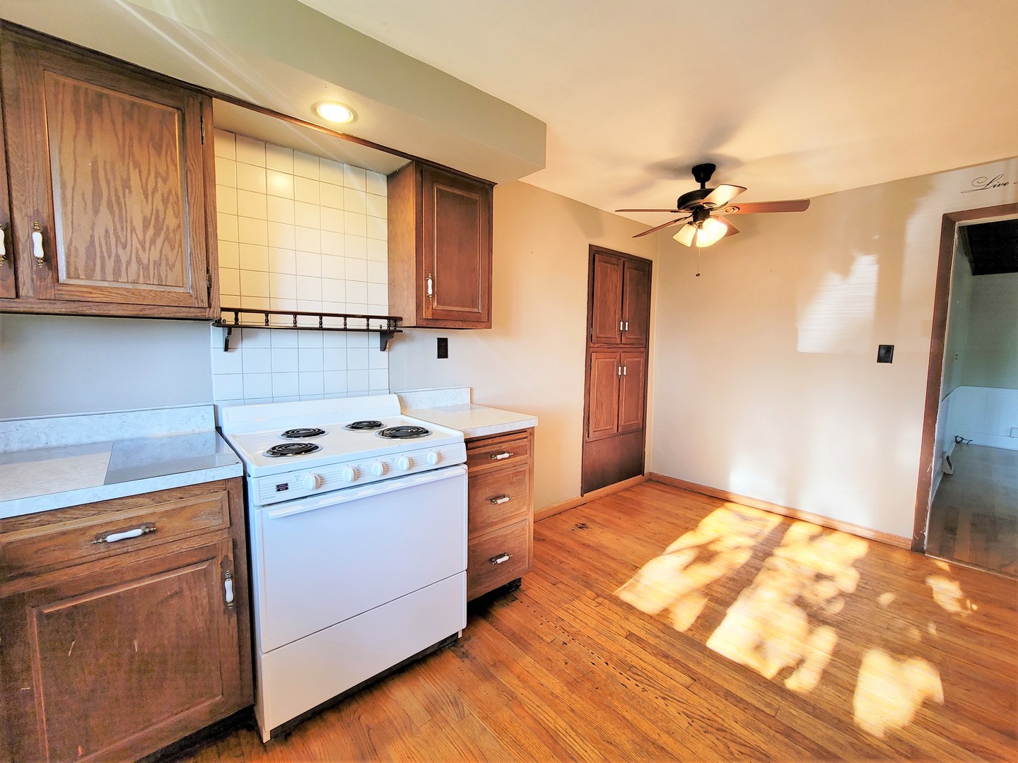 6932 Randall Road Poplar Grove, IL 61065 - Photo 12 of 44 a kitchen with a stove a sink and a window