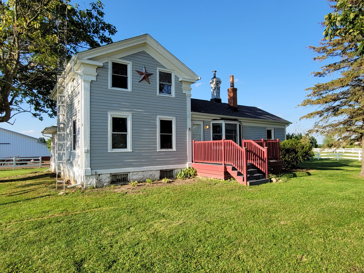 6932 Randall Road Poplar Grove, IL 61065 - Photo 3 of 44 a front view of a house with garden and a tree