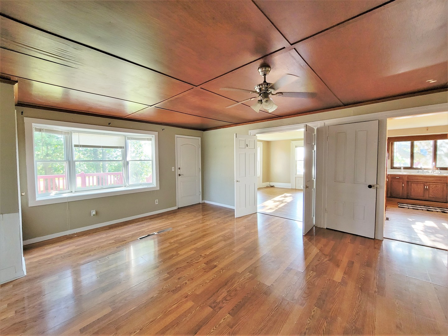 6932 Randall Road Poplar Grove, IL 61065 - Photo 4 of 44 a view of empty room with wooden floor and fan