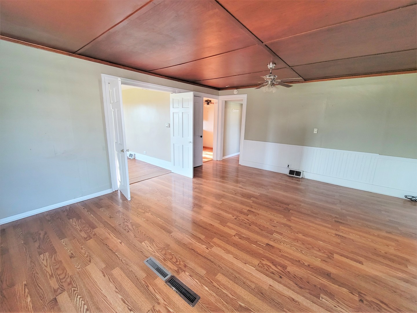 6932 Randall Road Poplar Grove, IL 61065 - Photo 5 of 44 an empty room with wooden floor and windows