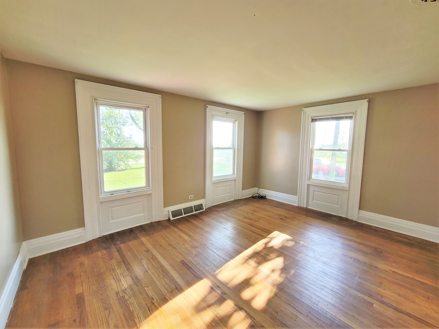 6932 Randall Road Poplar Grove, IL 61065 - Photo 9 of 44 a view of an empty room with wooden floor and window