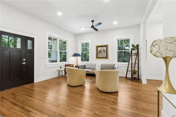a living room with furniture and a large window