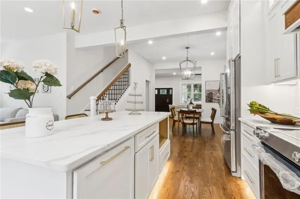 a kitchen with a sink stove and cabinets