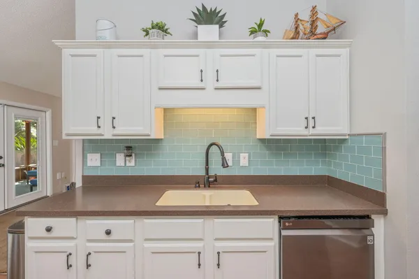 a kitchen with a stove and cabinets