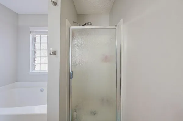 a white bath tub sitting in a bathroom