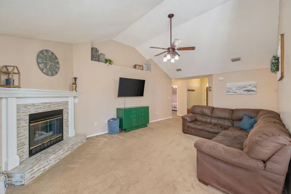 a dining room with furniture window and wooden floor