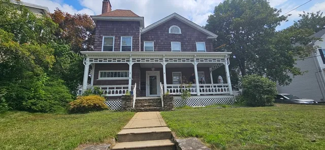 front view of a house with a yard