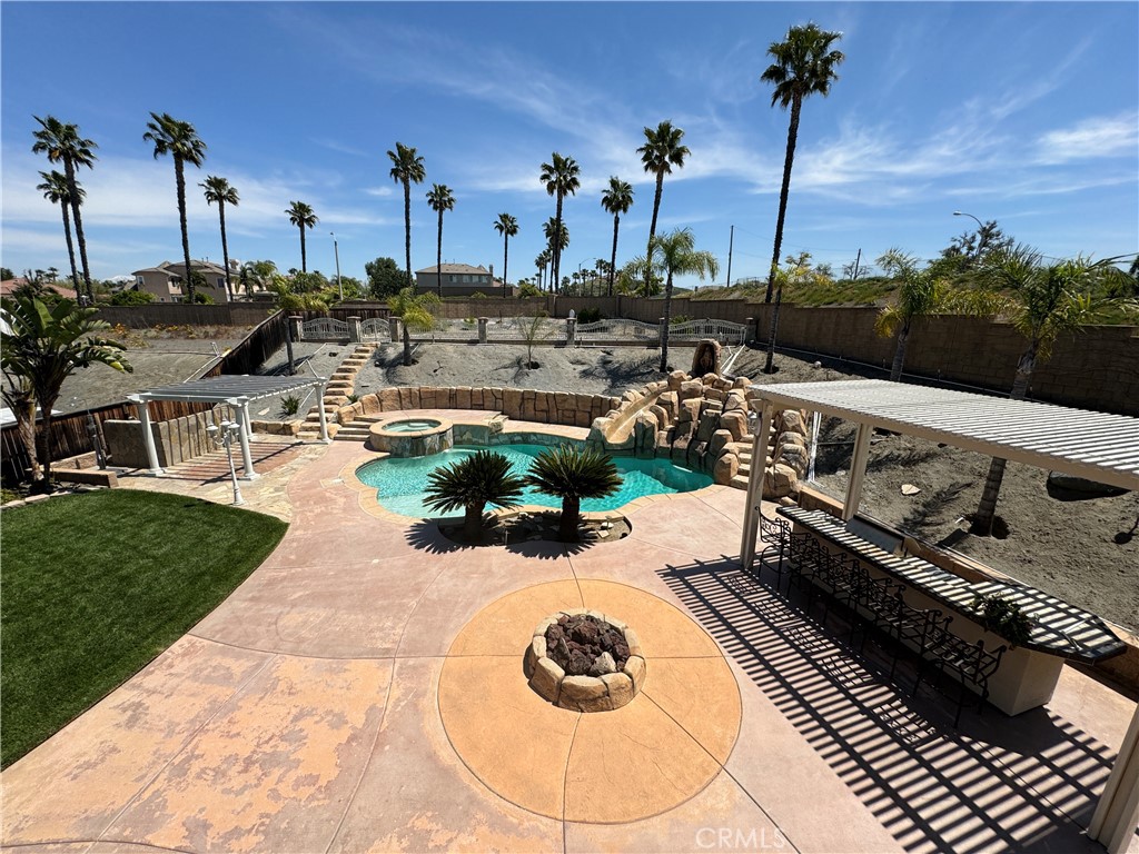 17482 Half Moon Court Riverside, CA 92503 - Photo 1 of 1 a view of a swimming pool and lounge chairs