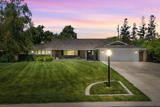 a front view of a house with yard