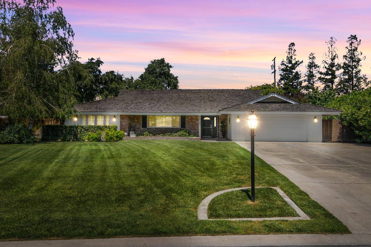 2433 Broadridge Way Stockton, CA 95209 - Photo 1 of 67 a front view of a house with yard
