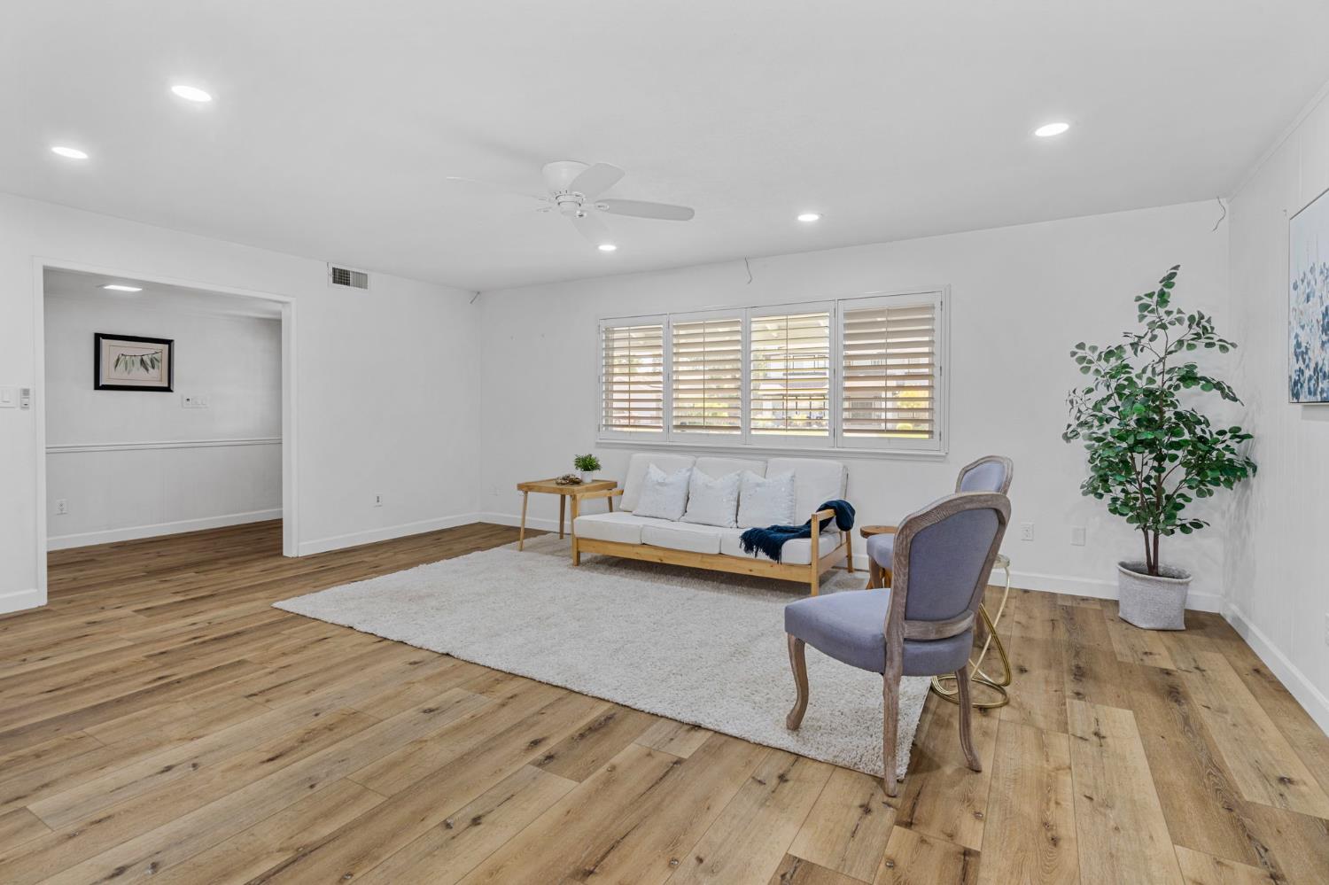 2433 Broadridge Way Stockton, CA 95209 - Photo 15 of 67 a living room with furniture and a potted plant