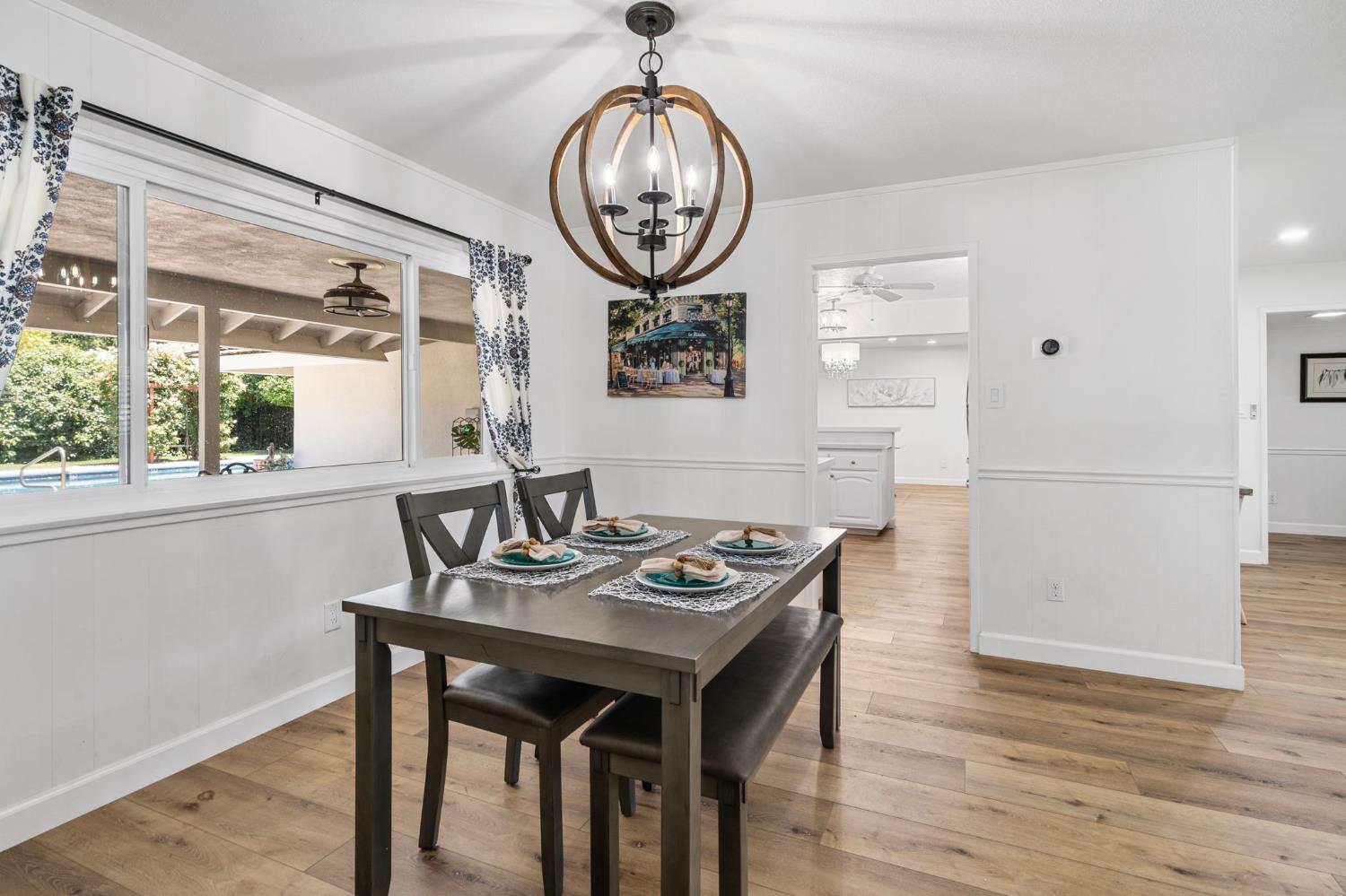 2433 Broadridge Way Stockton, CA 95209 - Photo 16 of 67 a view of a dining room with furniture window and wooden floor
