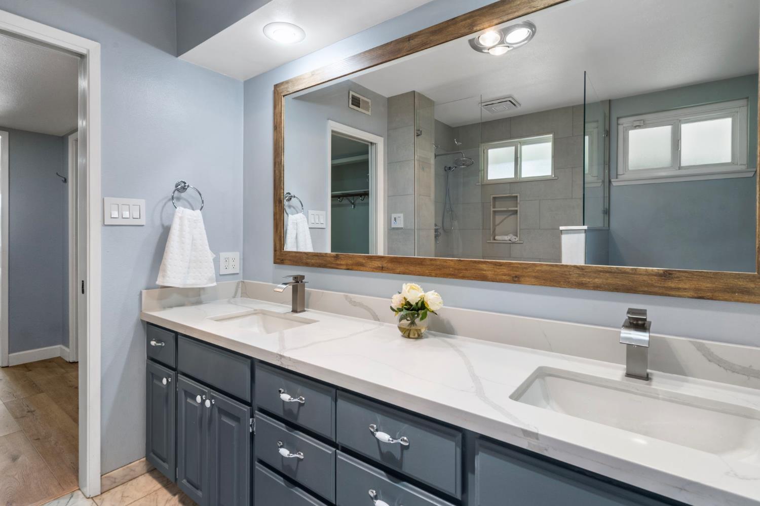 2433 Broadridge Way Stockton, CA 95209 - Photo 24 of 67 a bathroom with a sink and a mirror