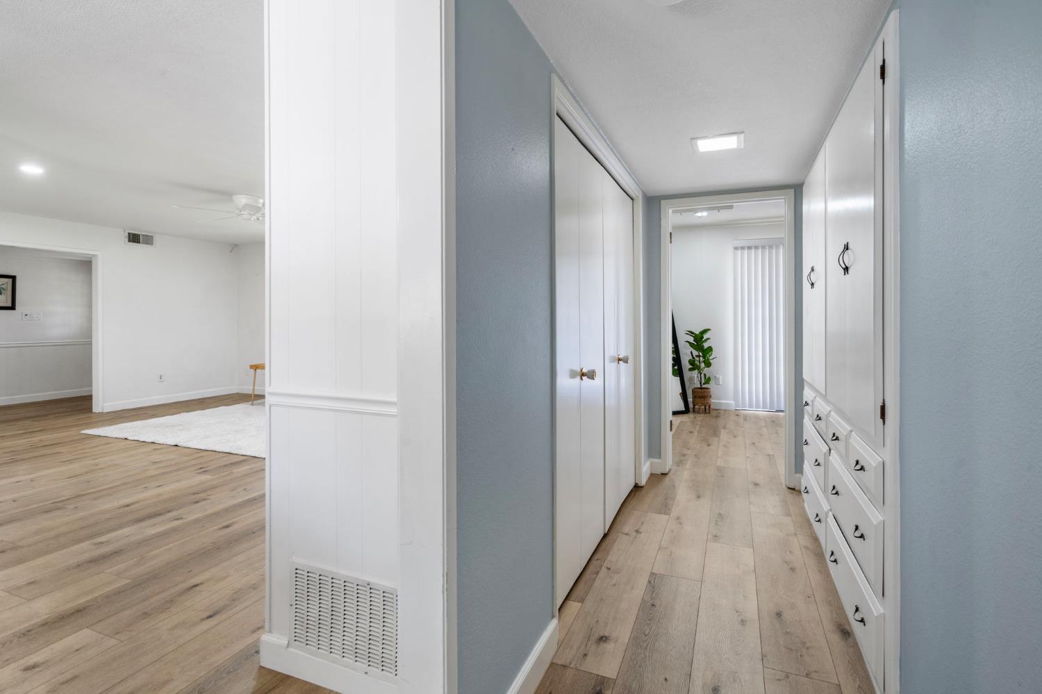 2433 Broadridge Way Stockton, CA 95209 - Photo 25 of 67 a view of a hallway with wooden floor and staircase