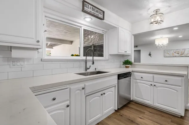 a view of hallway with wooden floor