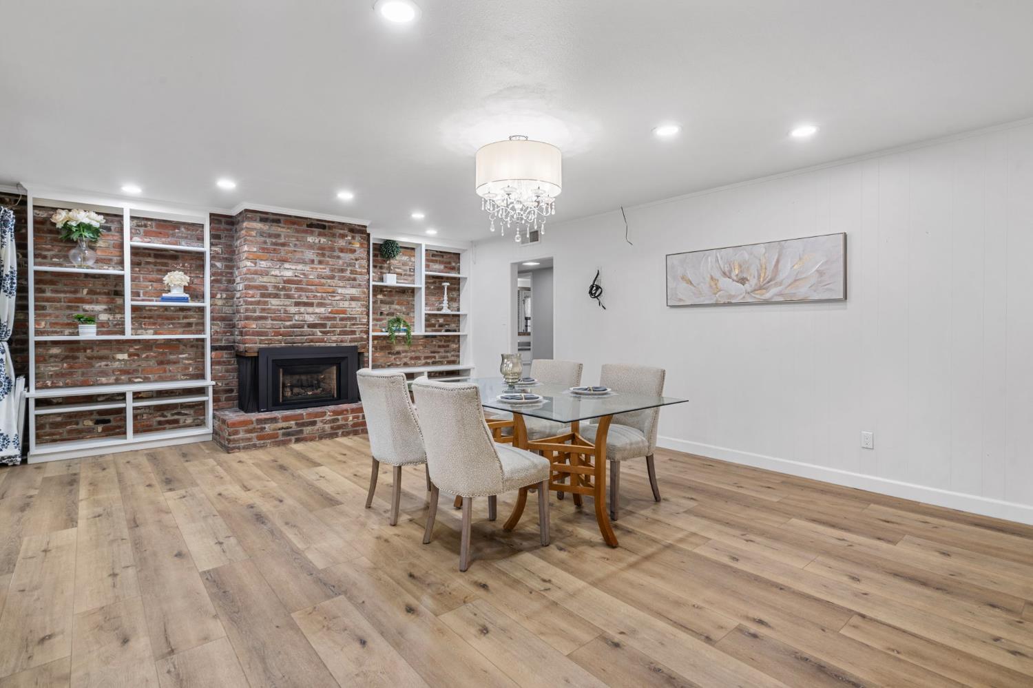 2433 Broadridge Way Stockton, CA 95209 - Photo 32 of 67 a view of a dining room with furniture and wooden floor