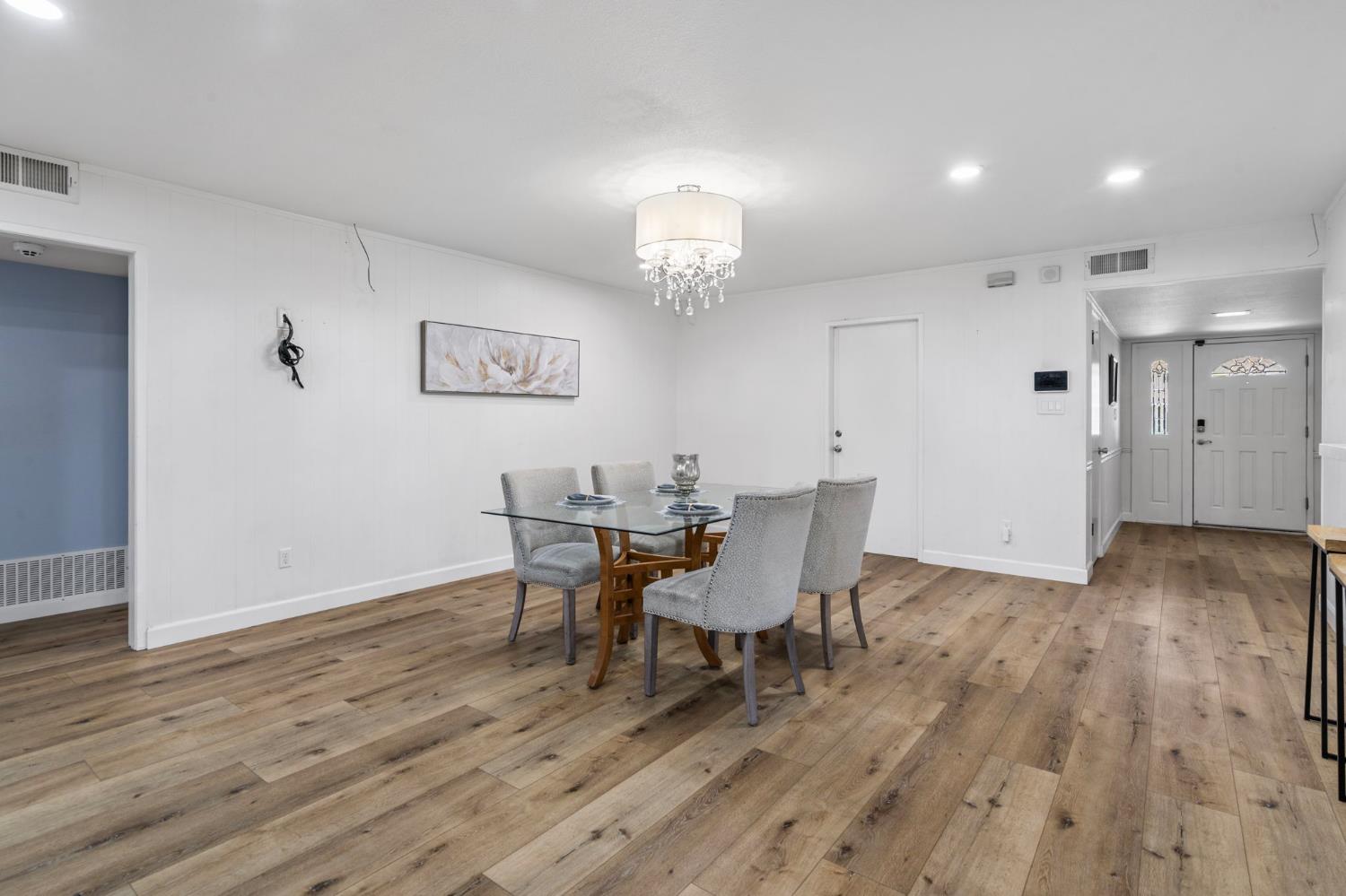 2433 Broadridge Way Stockton, CA 95209 - Photo 33 of 67 a view of a dining room with furniture and wooden floor