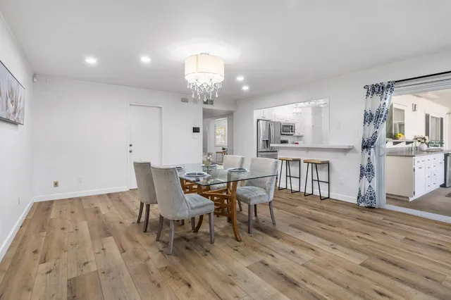 a view of a backyard with a tree