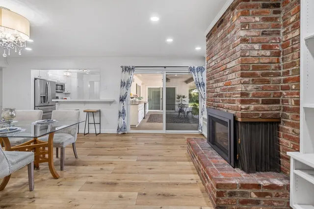 a view of a house with swimming pool and a yard