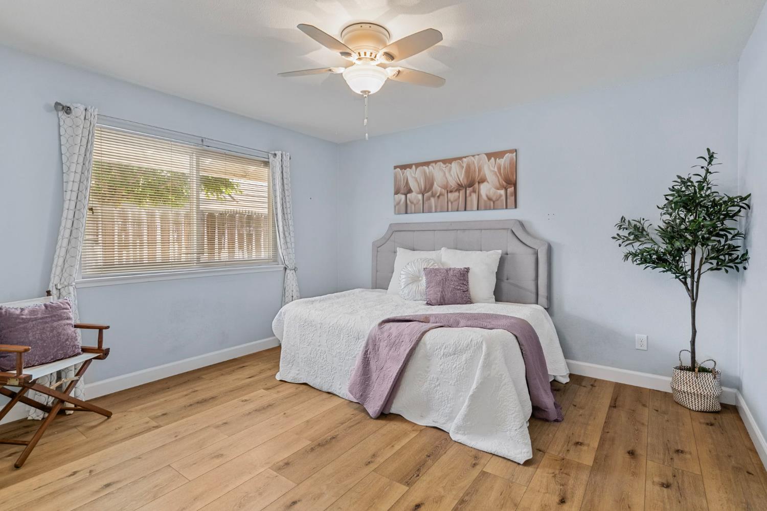 2433 Broadridge Way Stockton, CA 95209 - Photo 38 of 67 a spacious bedroom with a bed and a table