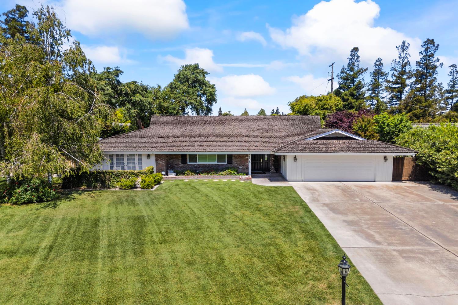 2433 Broadridge Way Stockton, CA 95209 - Photo 57 of 67 a front view of a house with a yard
