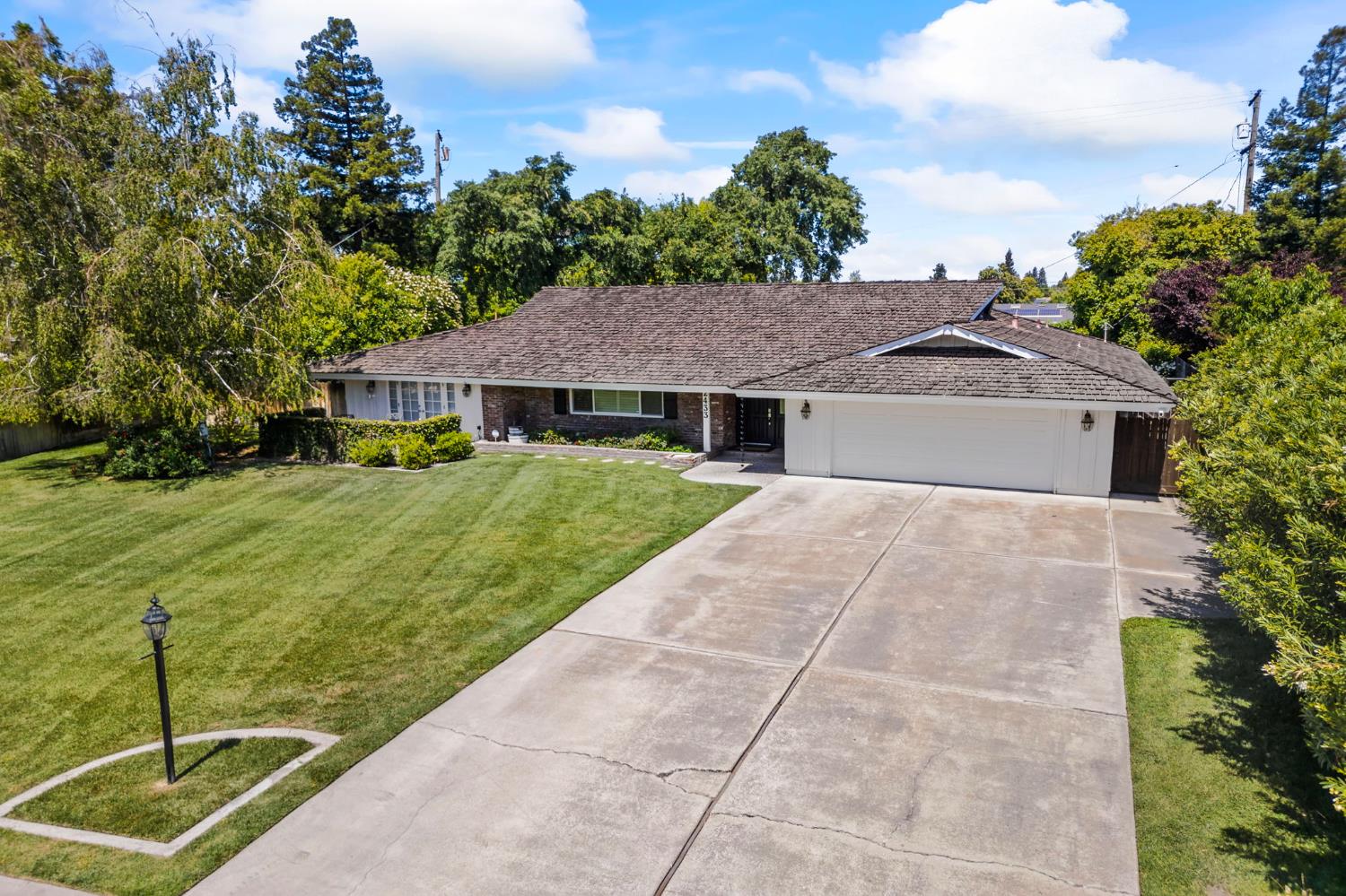 2433 Broadridge Way Stockton, CA 95209 - Photo 58 of 67 a house with green field in front of it