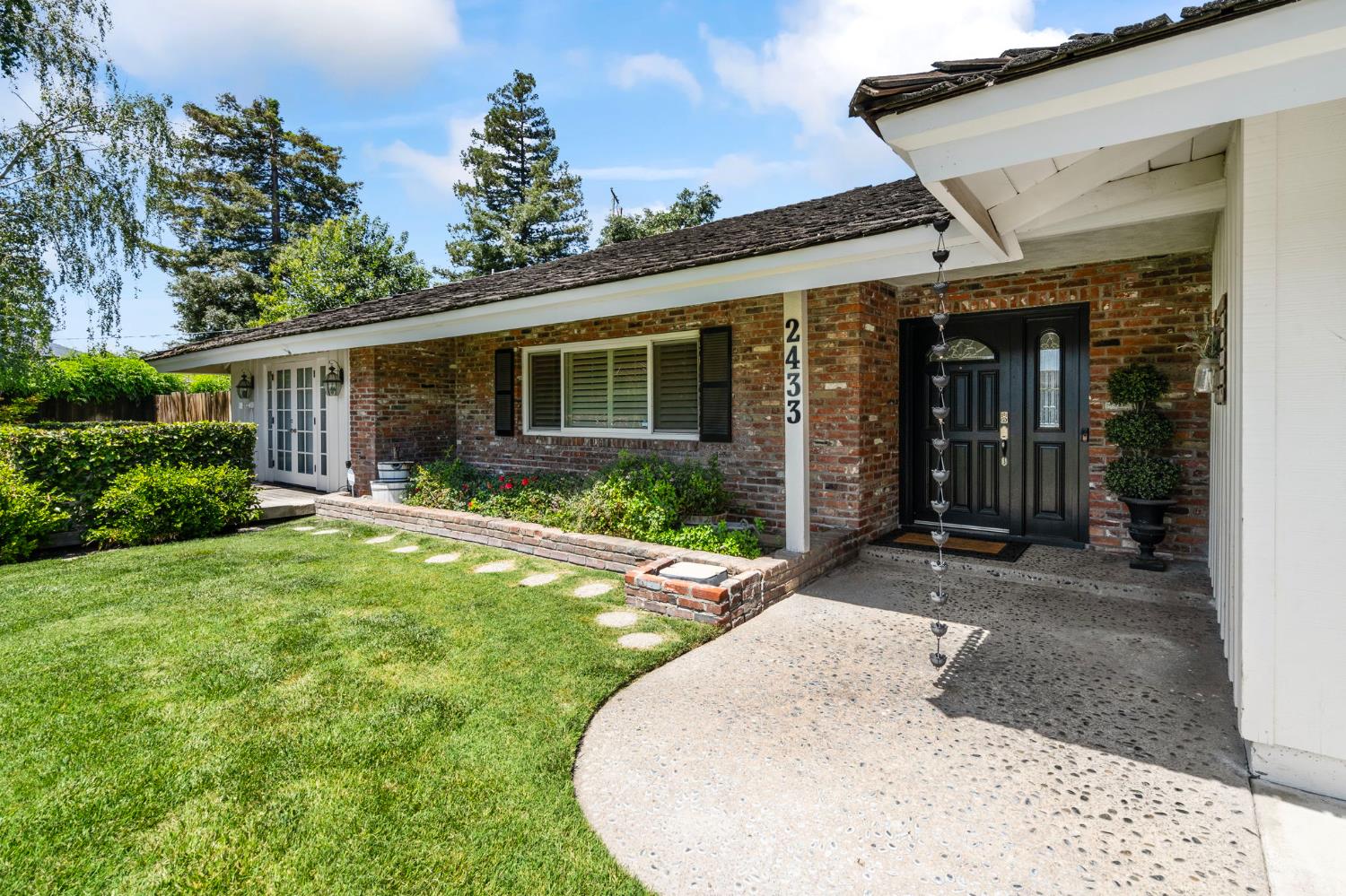 2433 Broadridge Way Stockton, CA 95209 - Photo 9 of 67 front view of a house with a yard