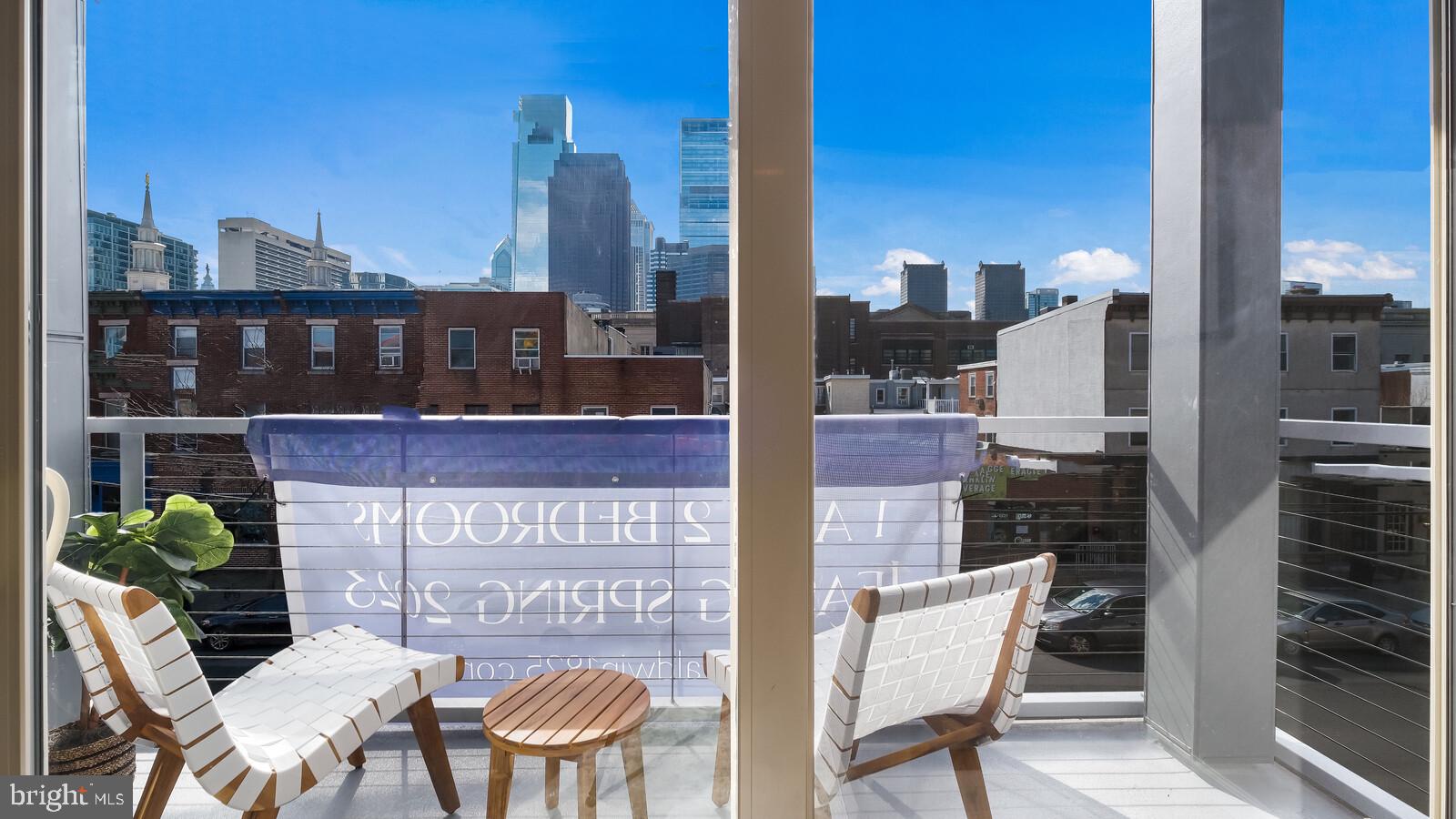 1825 Callowhill Street, Unit 511 Philadelphia, PA 19130 - Photo 14 of 50 a view of a balcony with furniture