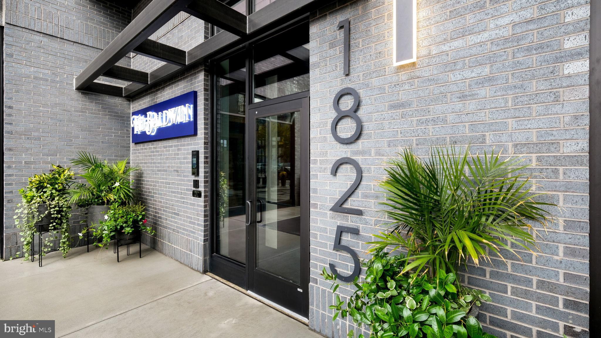 1825 Callowhill Street, Unit 511 Philadelphia, PA 19130 - Photo 40 of 50 a potted plant in front of a brick building