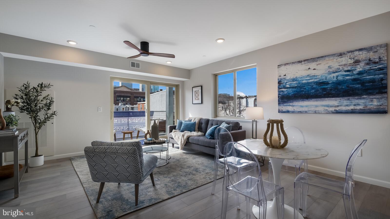 1825 Callowhill Street, Unit 511 Philadelphia, PA 19130 - Photo 9 of 50 a living room with furniture and flowers