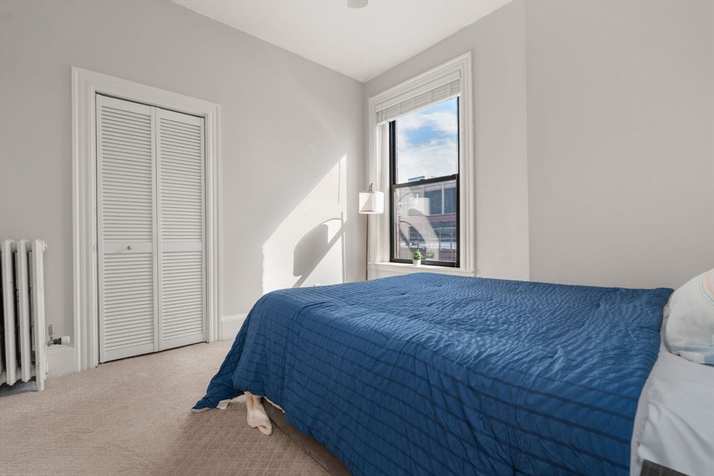 362 Commonwealth Avenue, Unit 6D Boston, MA 02115 - Photo 6 of 15 a bedroom with a bed and a window
