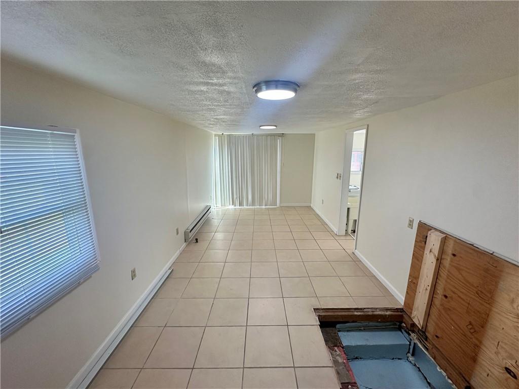1023 Burtner Road Natrona Heights, PA 15065 - Photo 17 of 33 a view of an empty room and wooden floor