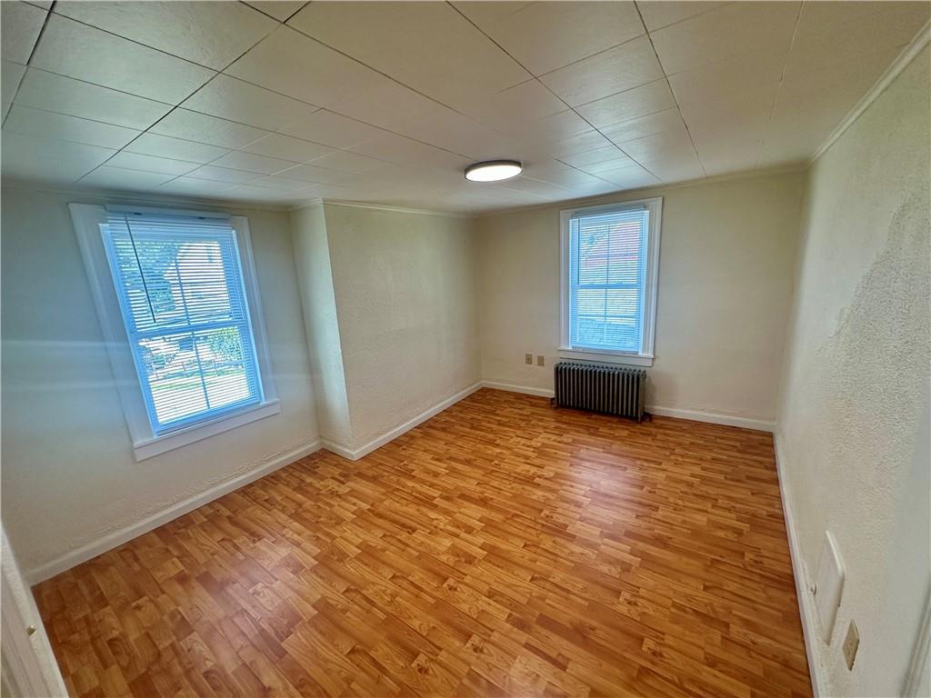 1023 Burtner Road Natrona Heights, PA 15065 - Photo 19 of 33 a view of empty room with wooden floor and fan