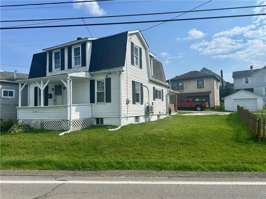1023 Burtner Road Natrona Heights, PA 15065 - Photo 3 of 33 a front view of a house with a yard