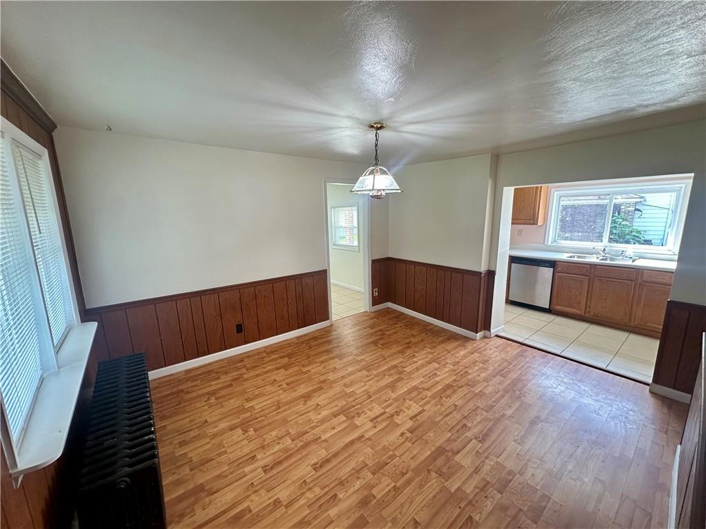 1023 Burtner Road Natrona Heights, PA 15065 - Photo 7 of 33 a view of empty room with wooden floor and fan