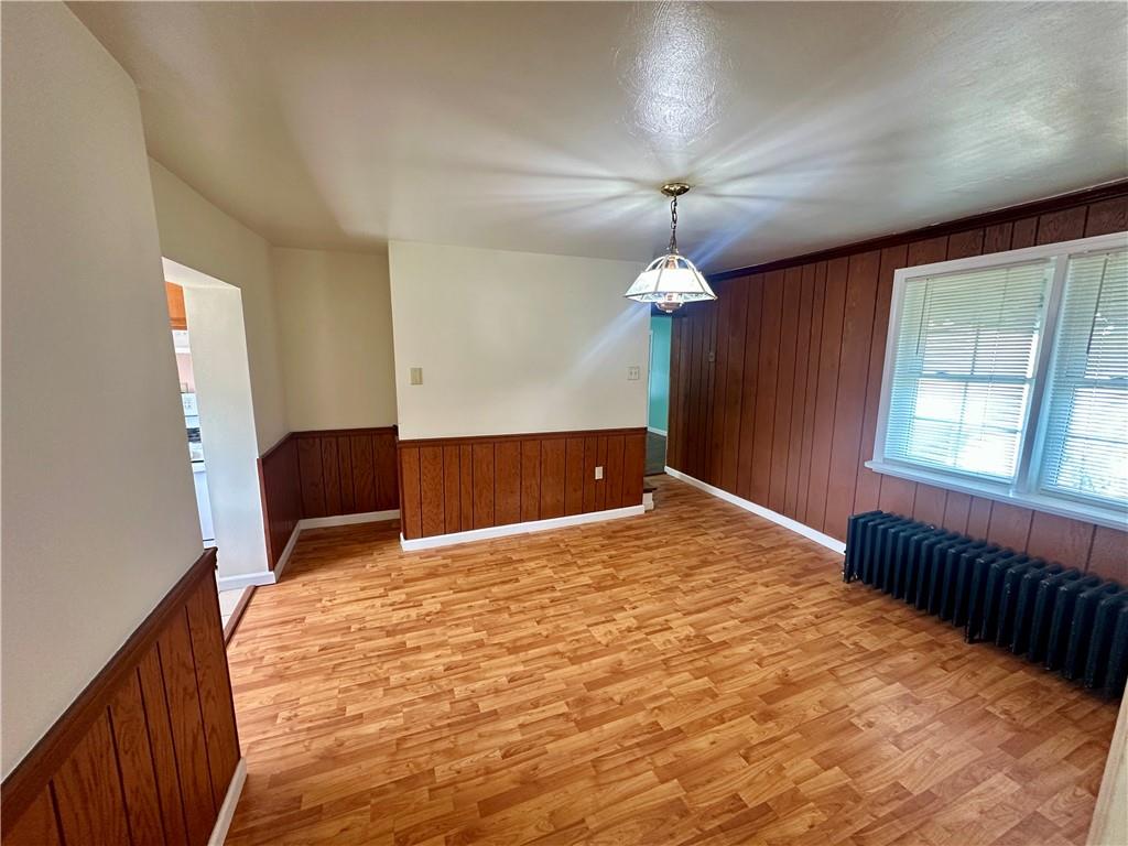 1023 Burtner Road Natrona Heights, PA 15065 - Photo 8 of 33 a bedroom with a bed and a chandelier
