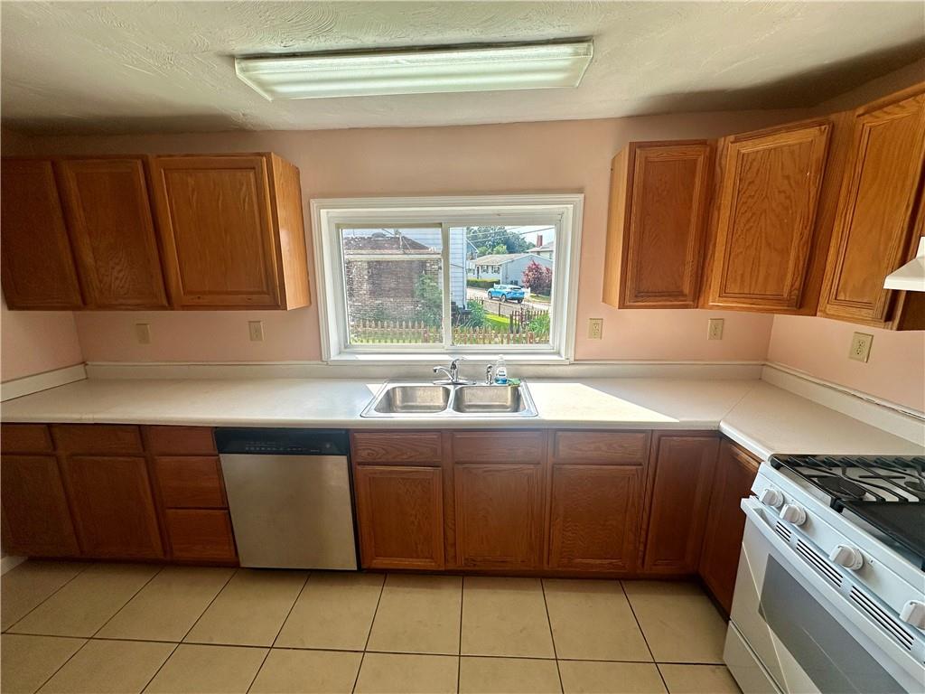 1023 Burtner Road Natrona Heights, PA 15065 - Photo 9 of 33 a kitchen with a sink and a stove top oven