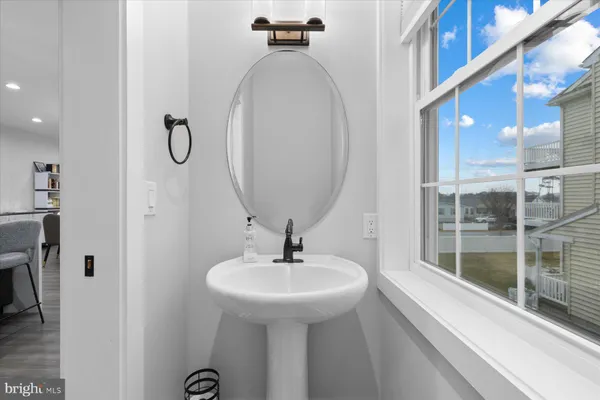 a bathroom with a sink and mirror