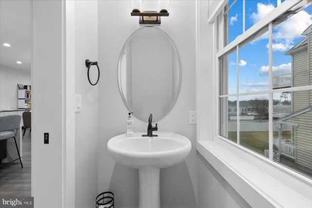 a bathroom with a sink and mirror