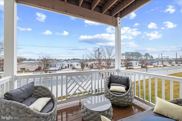 a view of a balcony with furniture