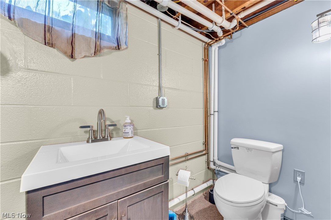 9897 West Ridge Road Elyria, OH 44035 - Photo 27 of 43 Bathroom featuring vanity and toilet