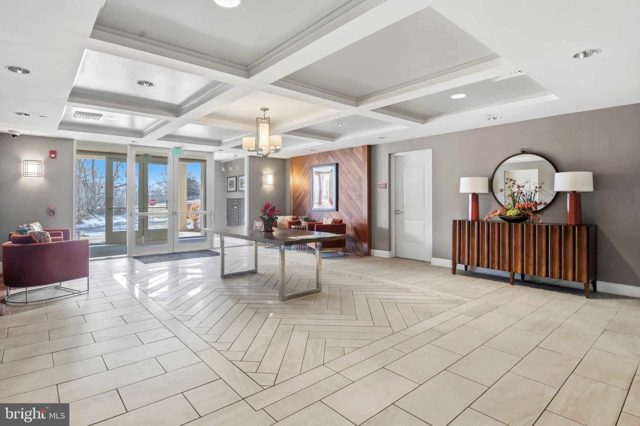 10520 Resort Road, Unit 303 Ellicott City, MD 21042 - Photo 11 of 11 a view of a lobby with furniture and a chandelier