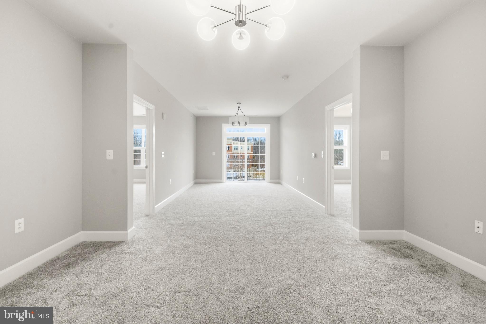10520 Resort Road, Unit 303 Ellicott City, MD 21042 - Photo 5 of 11 a view of an empty room with a window