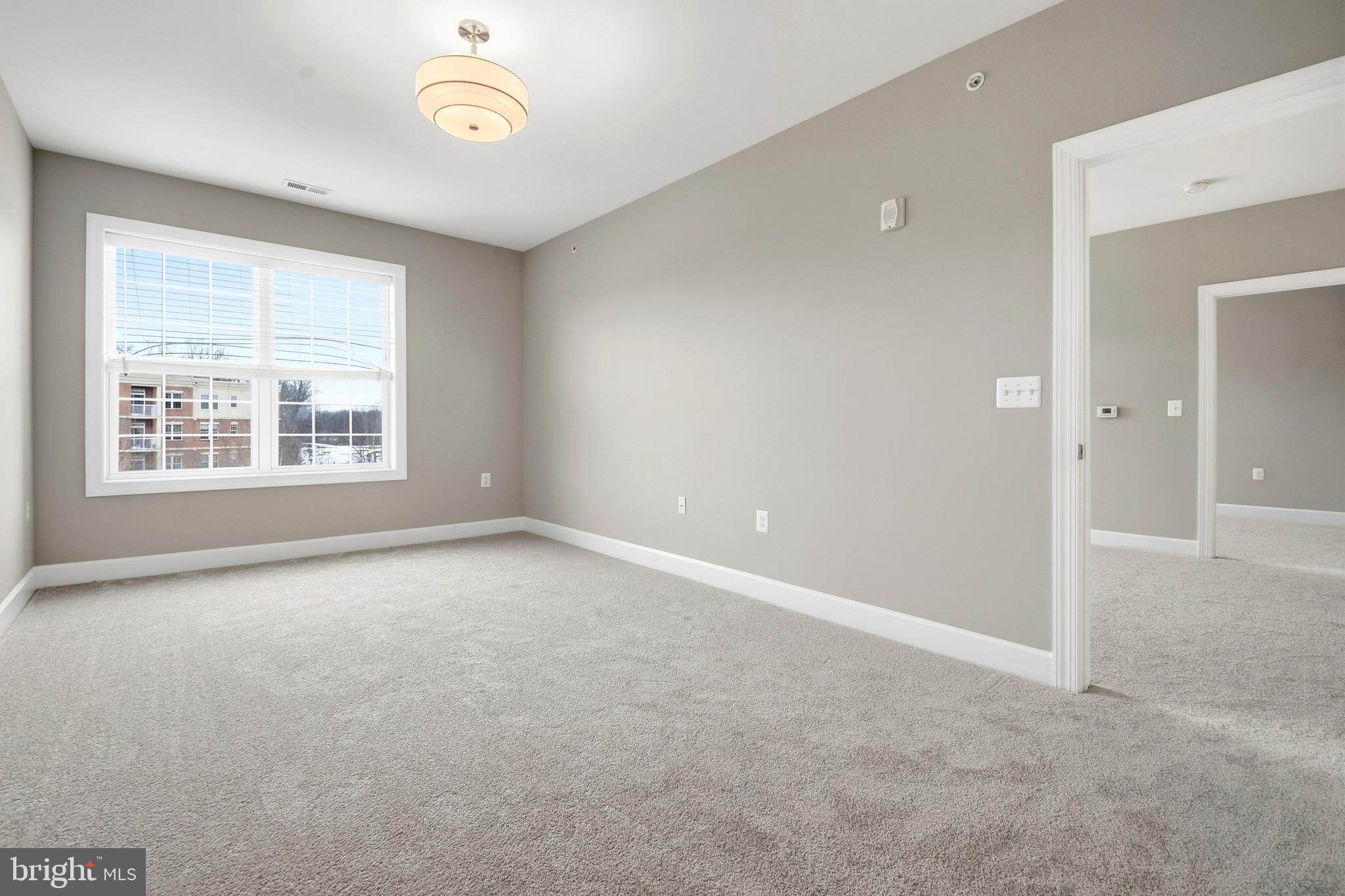 10520 Resort Road, Unit 303 Ellicott City, MD 21042 - Photo 7 of 11 an empty room with a window