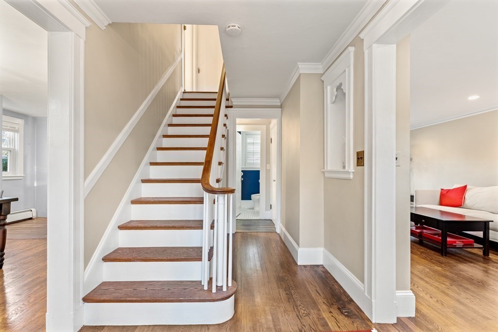 63 Oak Ridge Road Medford, MA 02155 - Photo 17 of 40 a view of a hallway with wooden floor and entryway