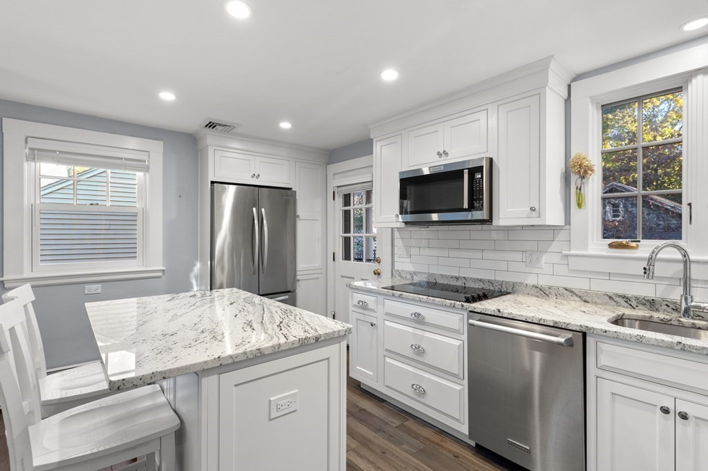 63 Oak Ridge Road Medford, MA 02155 - Photo 20 of 40 a kitchen that has a sink and a stove top oven