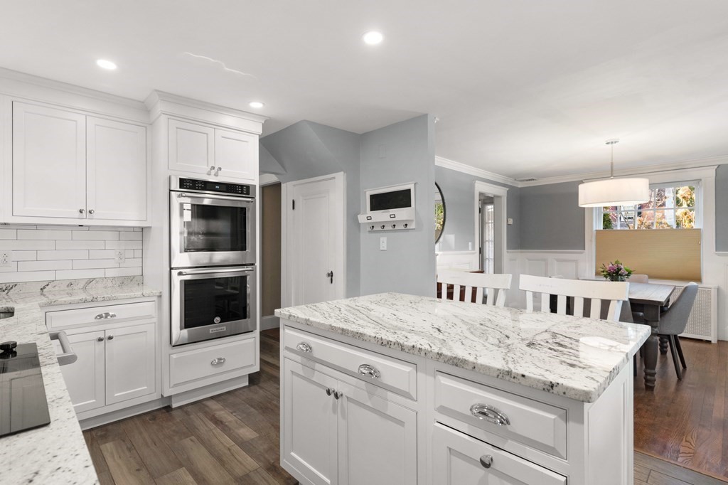 63 Oak Ridge Road Medford, MA 02155 - Photo 23 of 40 a kitchen with a stove a sink and a refrigerator