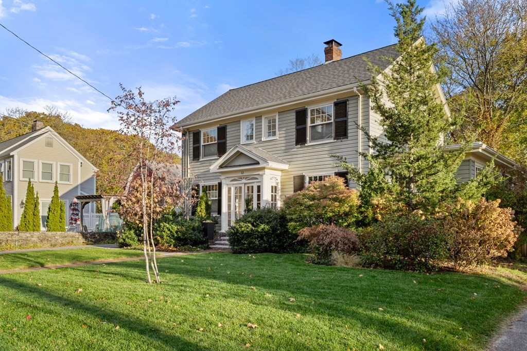 63 Oak Ridge Road Medford, MA 02155 - Photo 3 of 40 a front view of a house with a yard