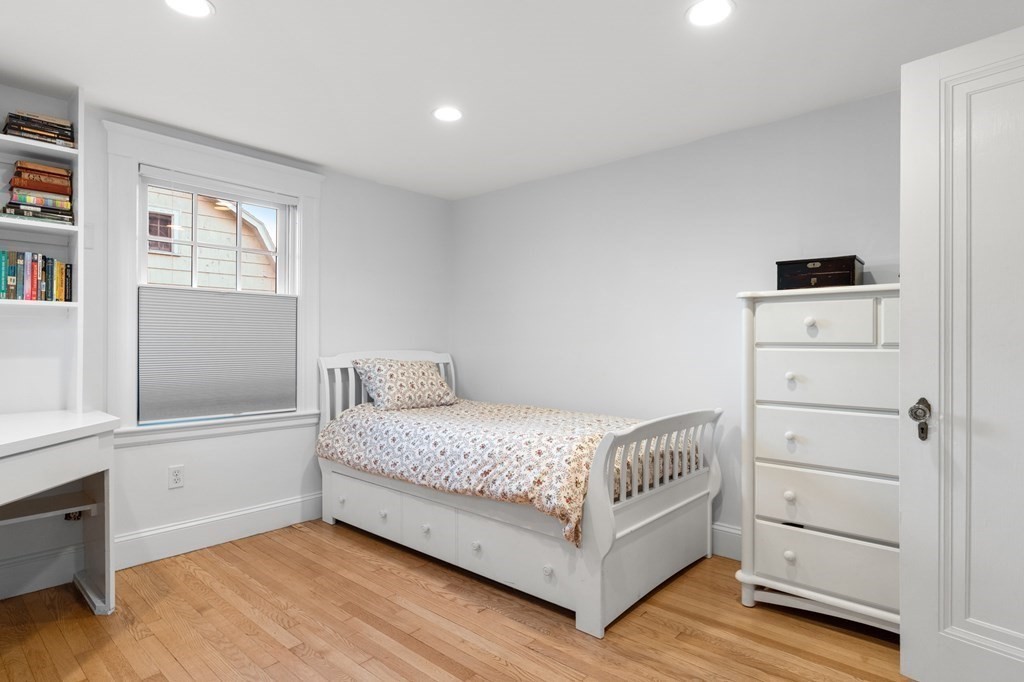 63 Oak Ridge Road Medford, MA 02155 - Photo 37 of 40 a room with a bed and a window