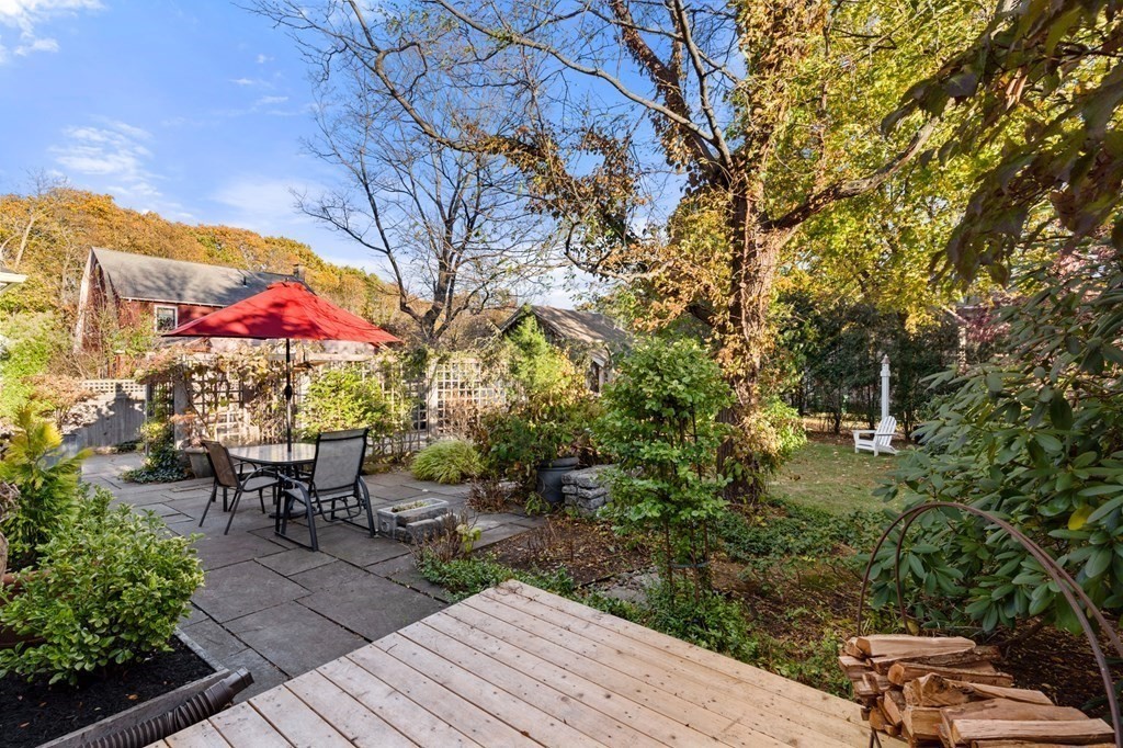 63 Oak Ridge Road Medford, MA 02155 - Photo 5 of 40 a view of a tables and chairs on the roof deck